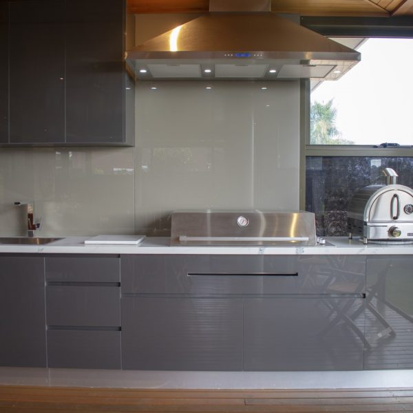 Modern grey gloss cabinets with feature copper extraction fan